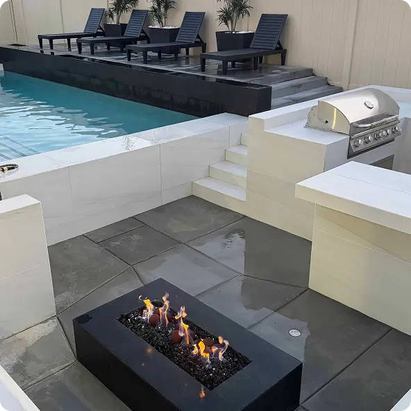 Modern backyard with swimming pool, firepit, barbecue grill, and lounge chairs